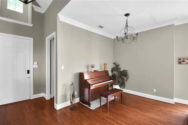 a room with furniture and wooden floor