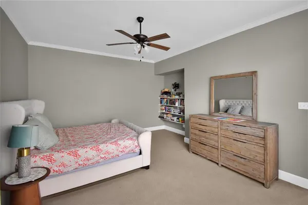 a bedroom with a bed and lamp