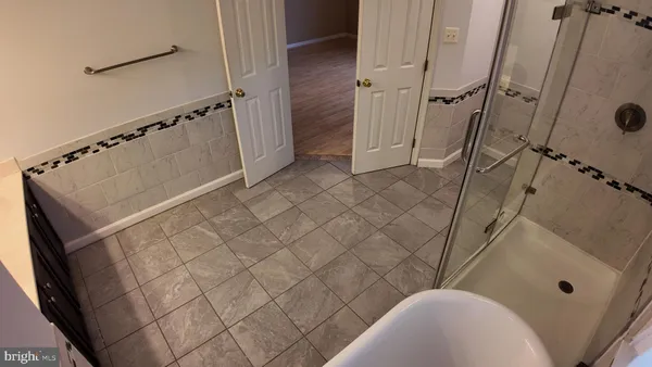 a bathroom with a sink and shower