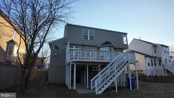 a front view of a house with wooden stairs