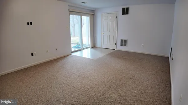 a view of empty room with windows