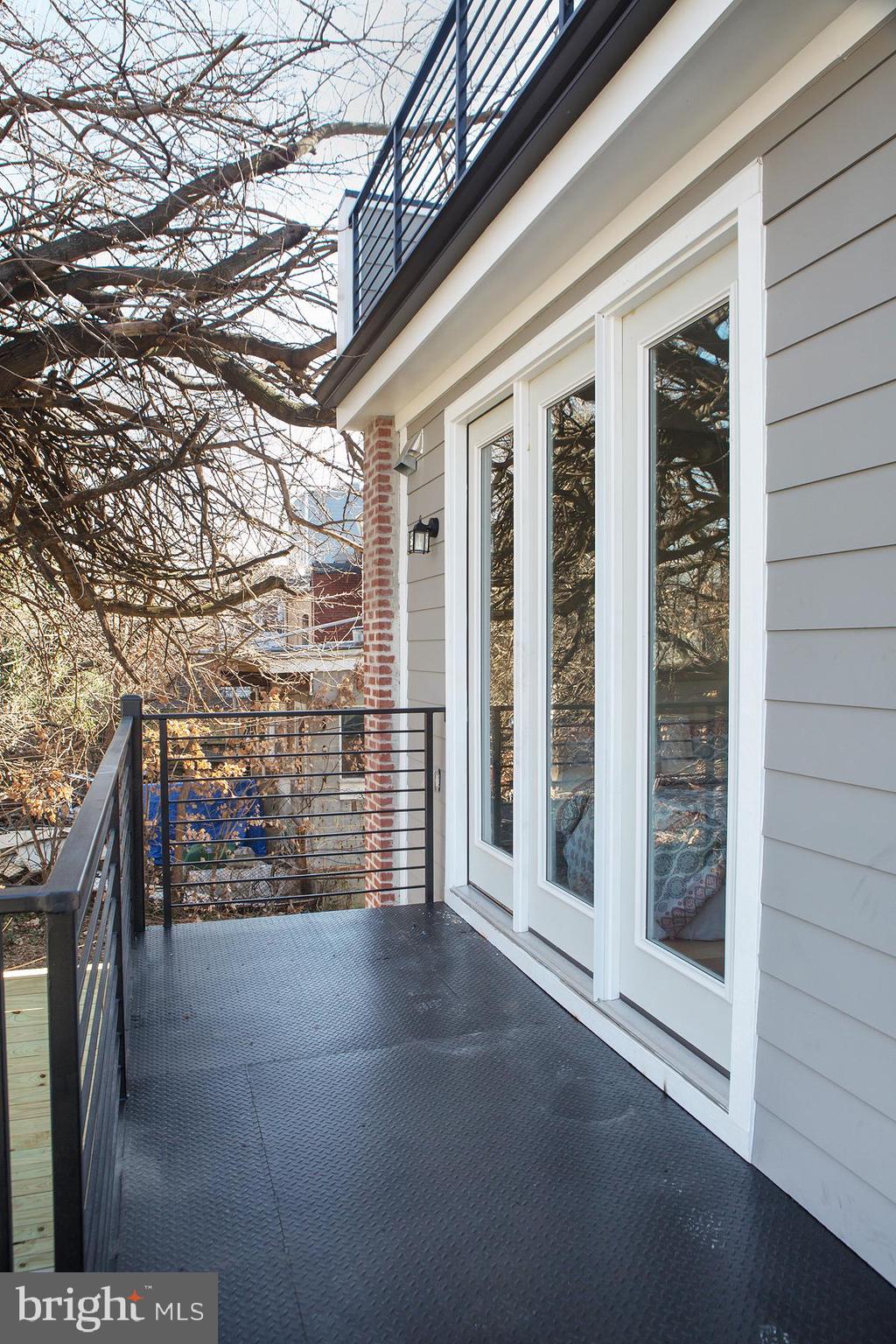 614 I Street Northeast, Unit 2 Washington, DC 20002 - Photo 27 of 48 Rear Patio Deck& Spiral Stairs down