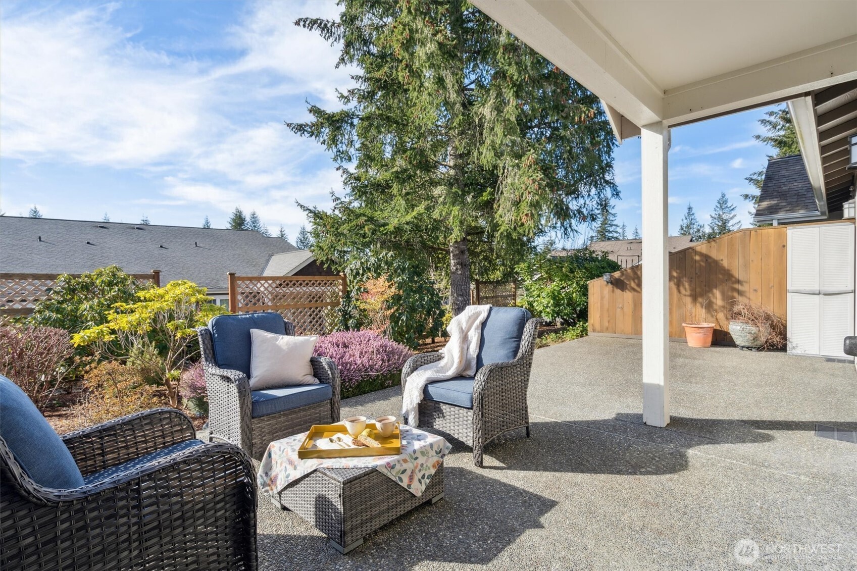 160 East Soderberg Road, Unit N38 Allyn, WA 98524 - Photo 1 of 29 a outdoor living space with furniture and a potted plant