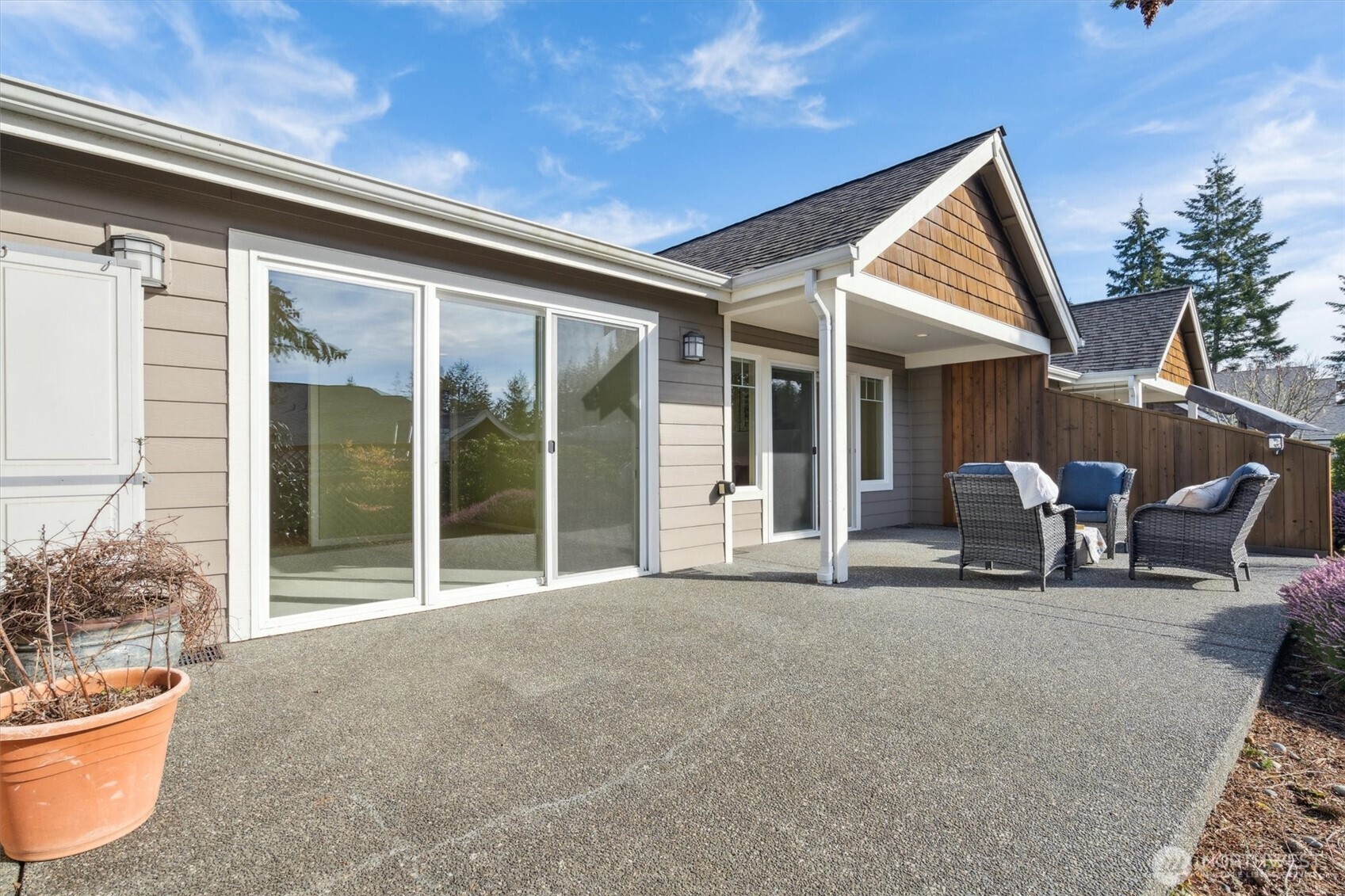 160 East Soderberg Road, Unit N38 Allyn, WA 98524 - Photo 18 of 29 a backyard of a house with table and chairs