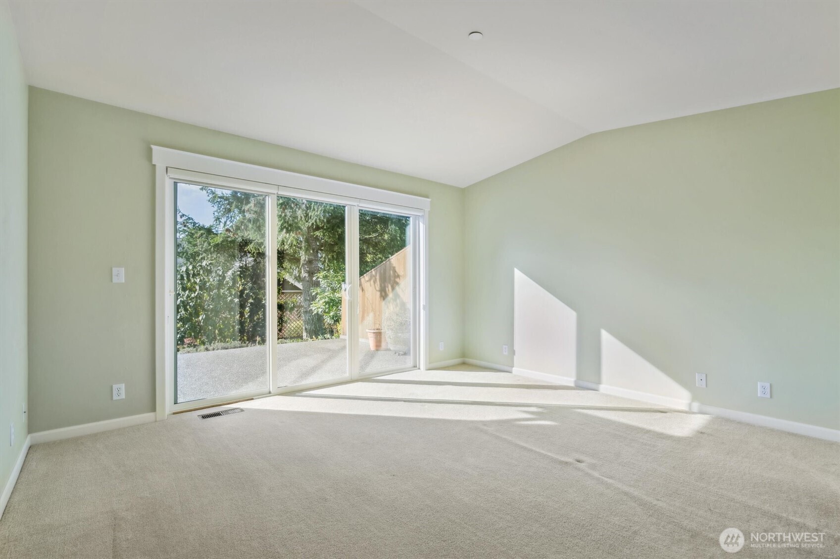 160 East Soderberg Road, Unit N38 Allyn, WA 98524 - Photo 19 of 29 a view of an empty room with wooden floor and a window