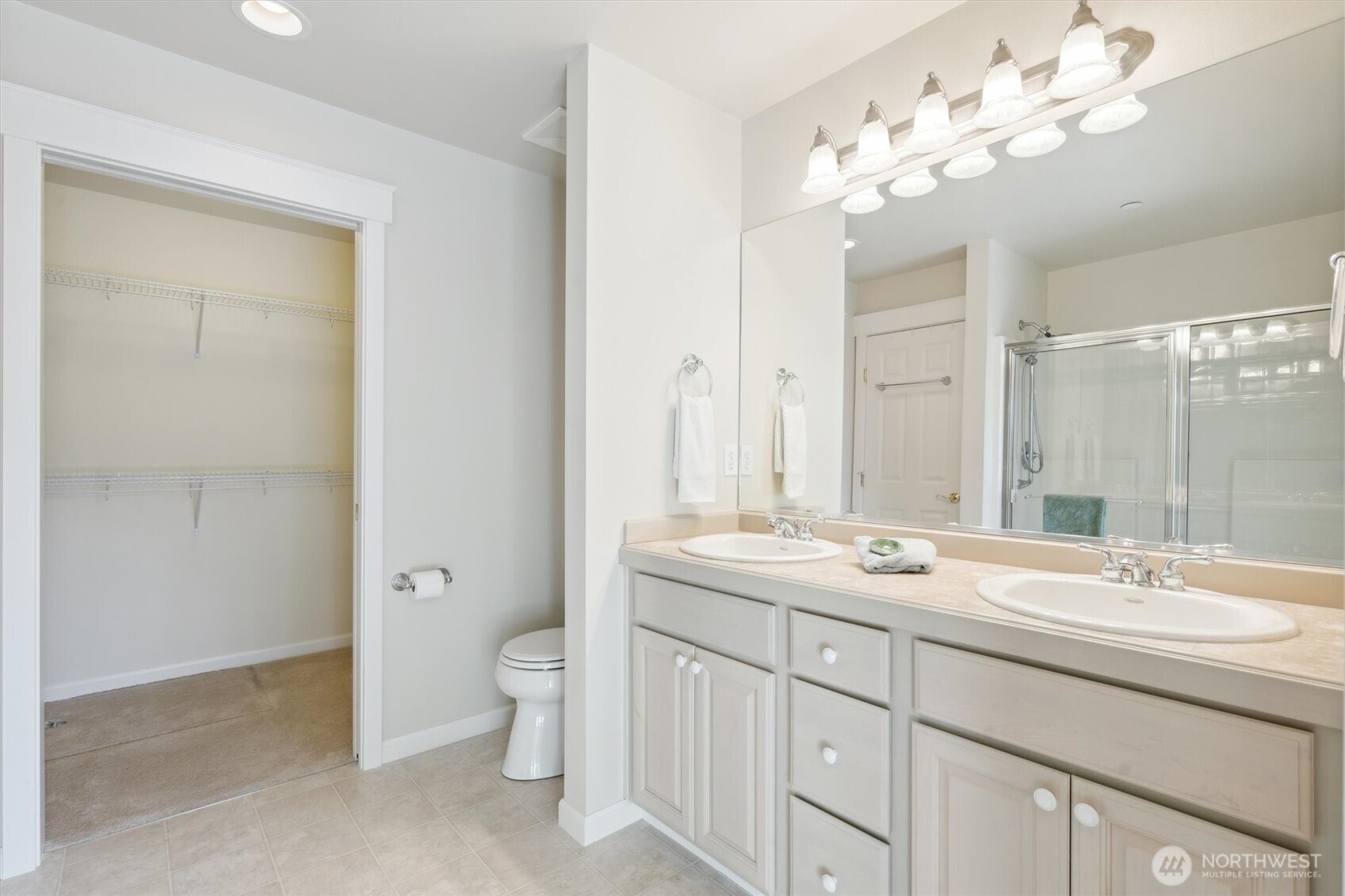 160 East Soderberg Road, Unit N38 Allyn, WA 98524 - Photo 21 of 29 a bathroom with a double vanity sink mirror and toilet
