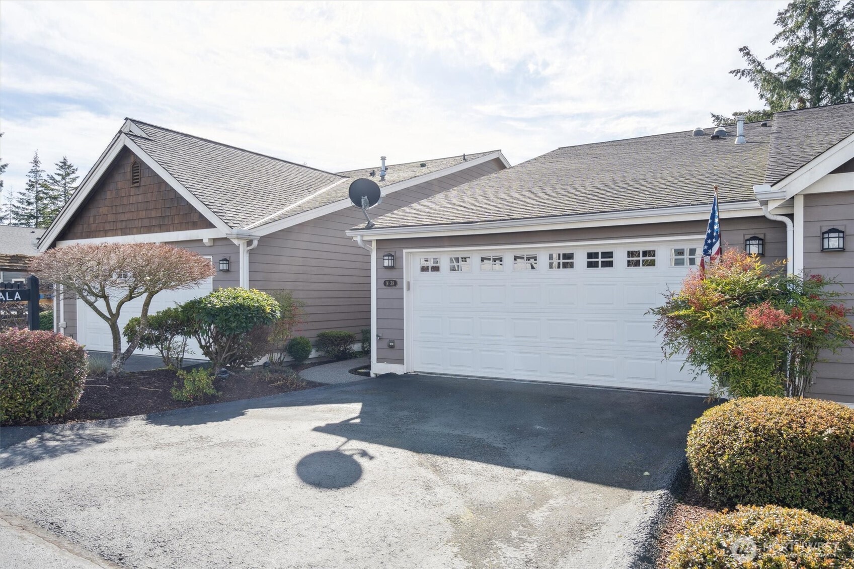 160 East Soderberg Road, Unit N38 Allyn, WA 98524 - Photo 28 of 29 a view of a house with a yard and potted plants