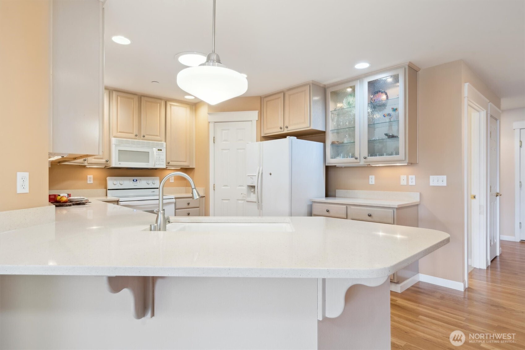 160 East Soderberg Road, Unit N38 Allyn, WA 98524 - Photo 6 of 29 a kitchen with a sink a refrigerator and cabinets