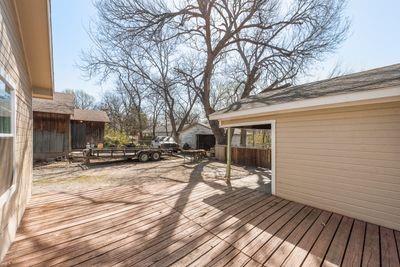 930 Freeman Street Sherman, TX 75092 - Photo 16 of 18 Expansive wood-finish deck spanning the rear of the property