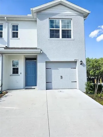 a front view of a house with a garage