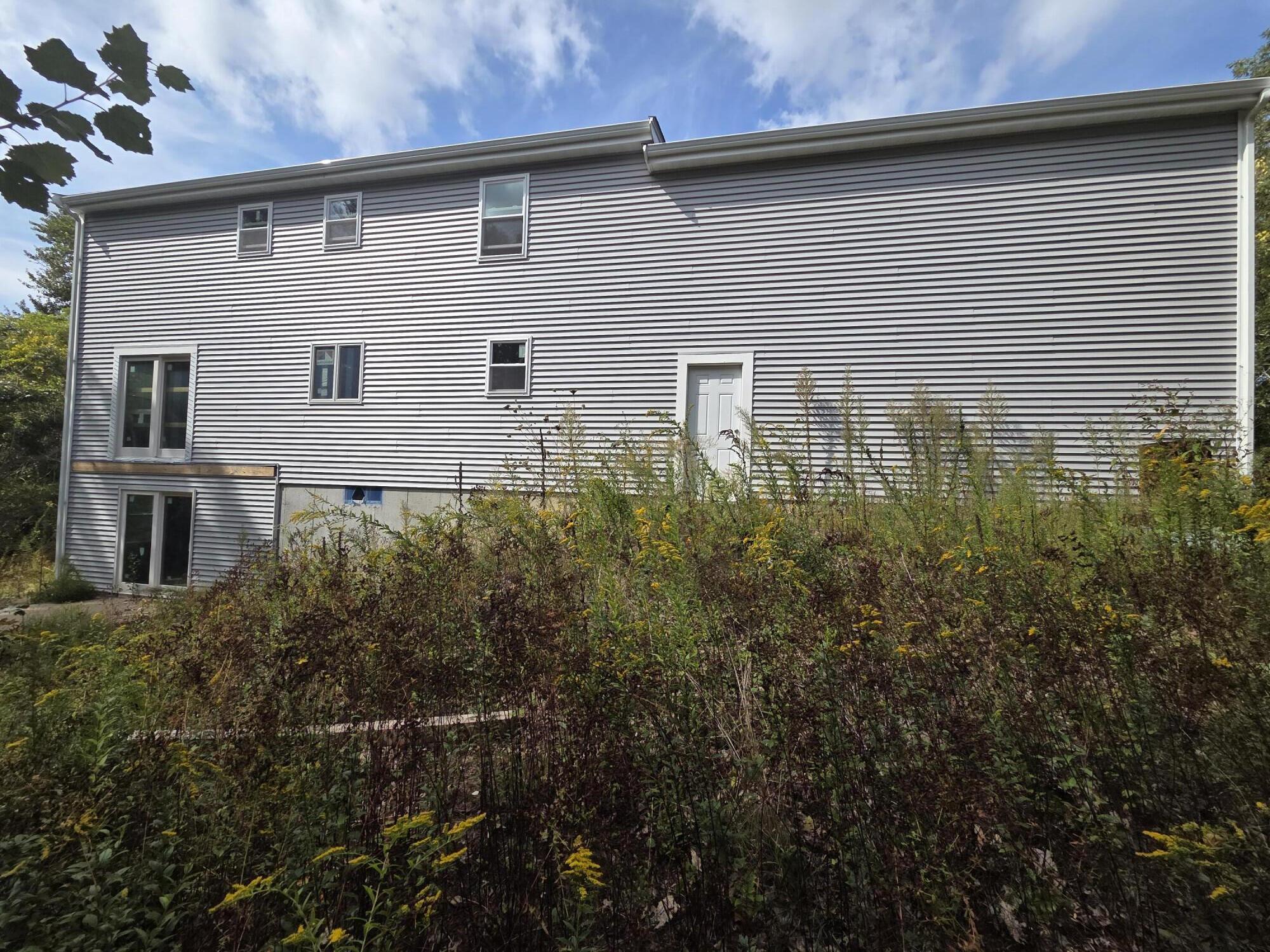 135 Sisson Road Harwich Port, MA 02646 - Photo 3 of 23 a front view of a house with plants