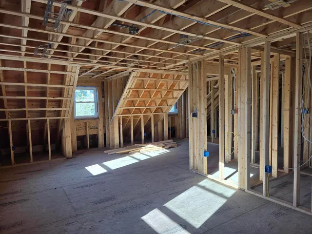 a view of an empty room with windows
