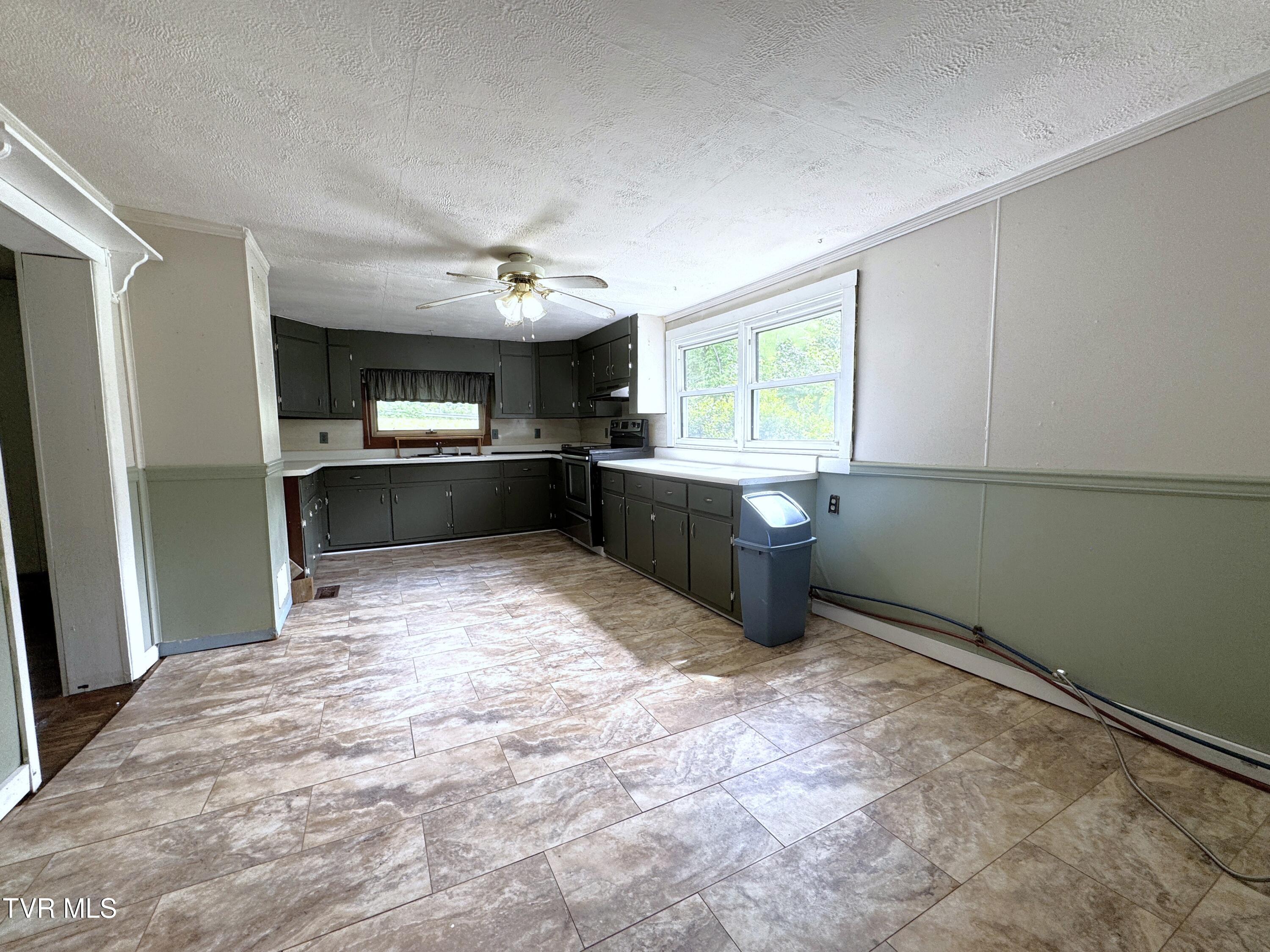 142 Sheryl Turner Road Big Stone Gap, VA 24219 - Photo 19 of 42 KITCHEN FROM MUD ROOM