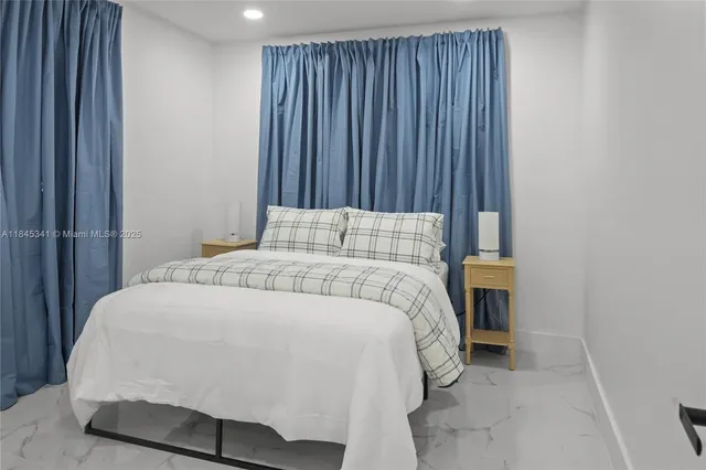 a bedroom with a bed and a cabinets