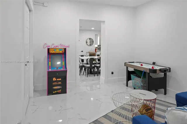 wooden floor and utility room with a table and chairs