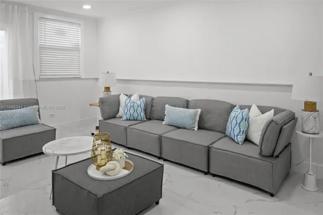 a living room with furniture and a couch