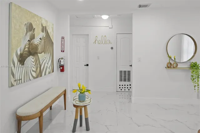 a bathroom with a bathtub sink and mirror