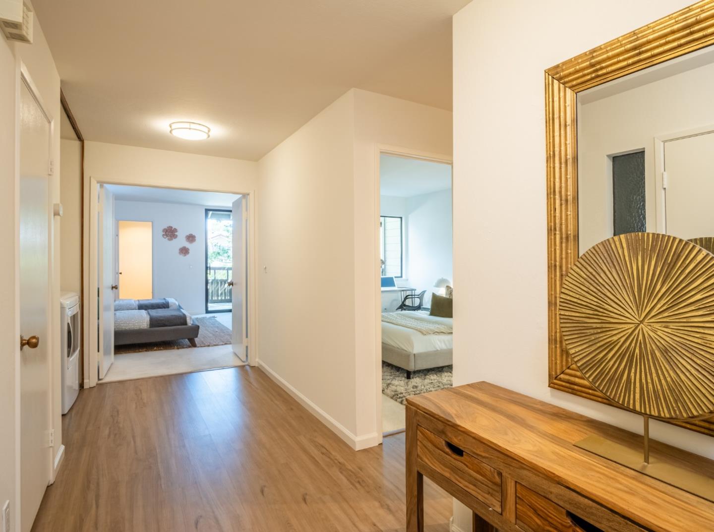 2040 West Middlefield Road, Unit 12 Mountain View, CA 94043 - Photo 12 of 24 a view of a livingroom with furniture and wooden floor