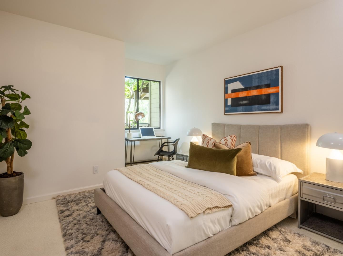 2040 West Middlefield Road, Unit 12 Mountain View, CA 94043 - Photo 15 of 24 a bedroom with a bed and a potted plant