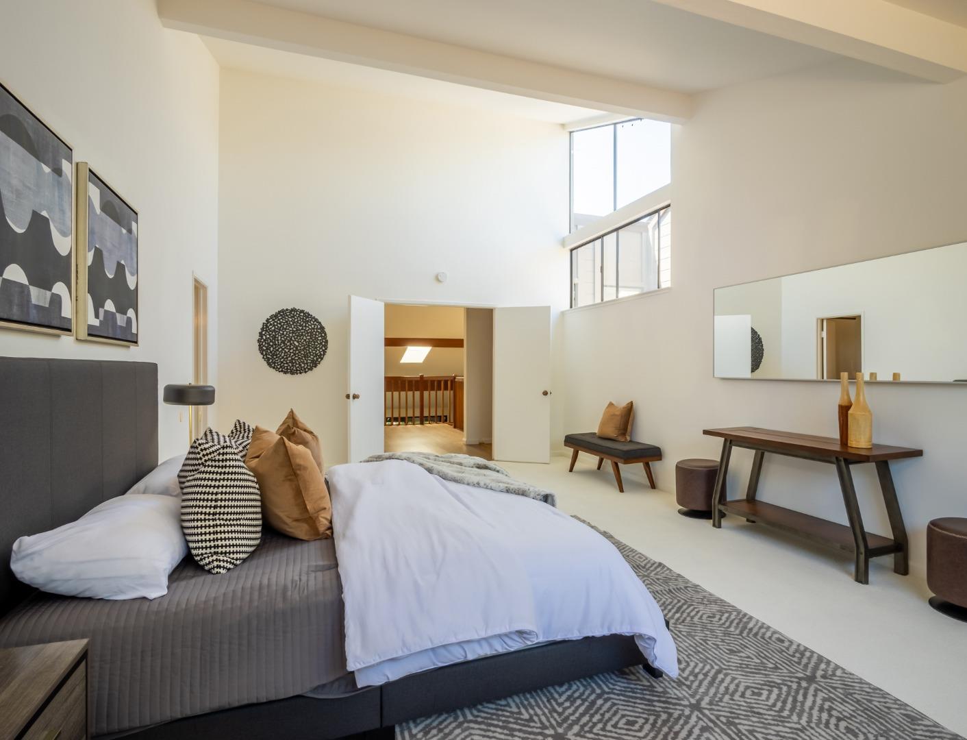 2040 West Middlefield Road, Unit 12 Mountain View, CA 94043 - Photo 17 of 24 a bedroom with a bed and chair