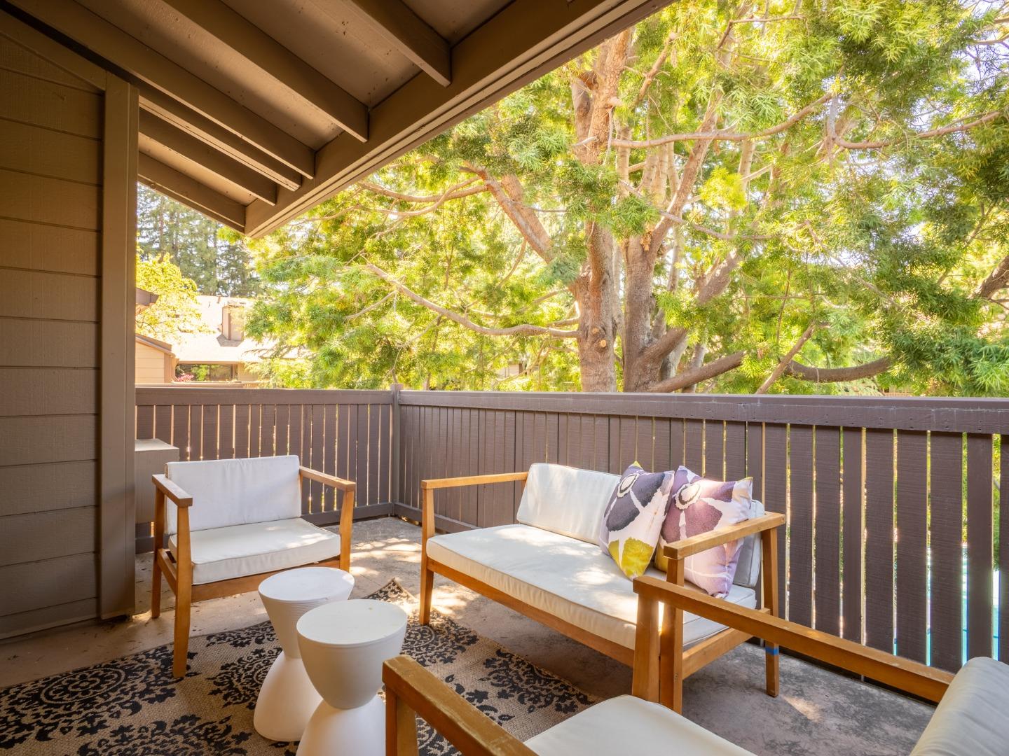 2040 West Middlefield Road, Unit 12 Mountain View, CA 94043 - Photo 18 of 24 a balcony with table and chairs
