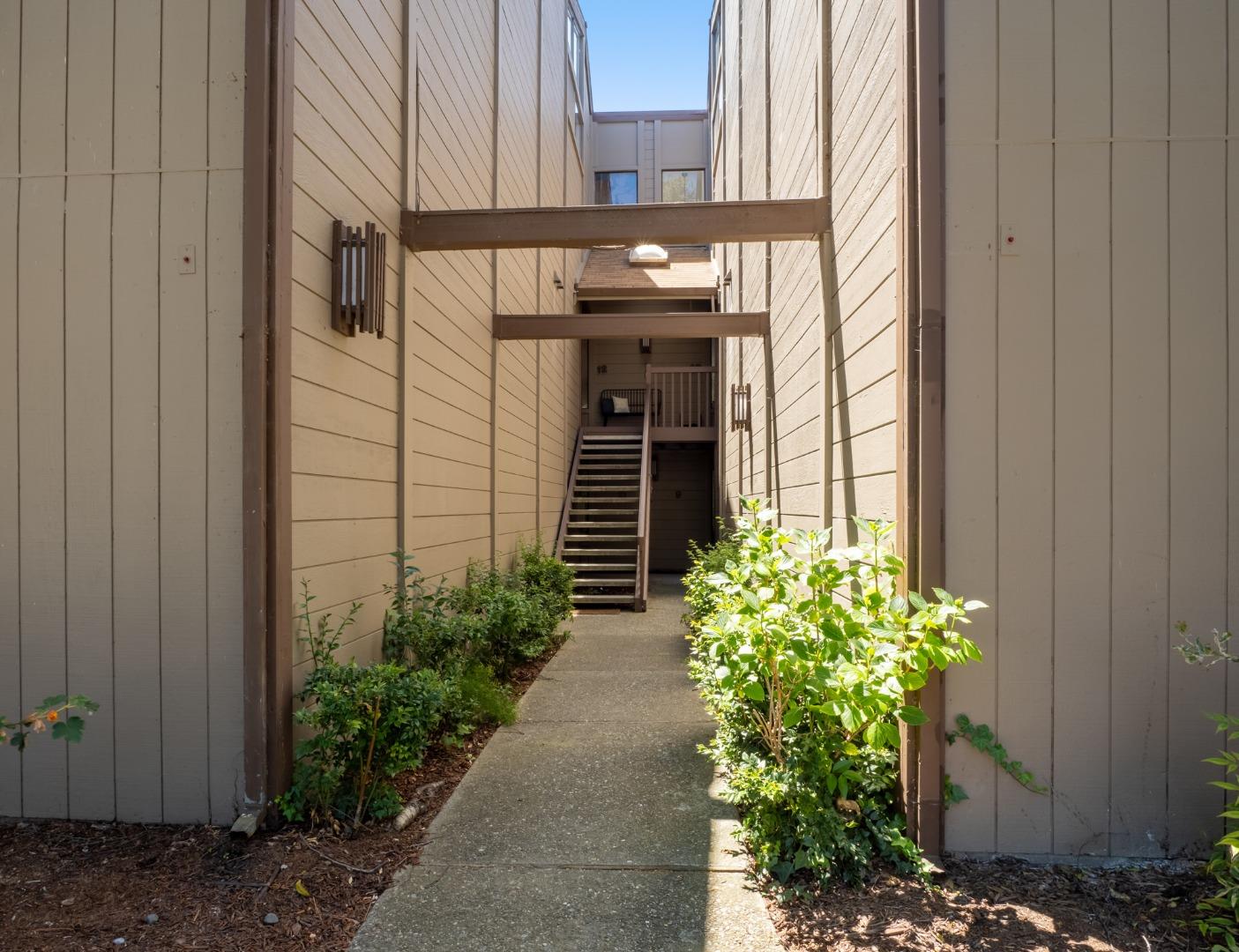 2040 West Middlefield Road, Unit 12 Mountain View, CA 94043 - Photo 20 of 24 a potted plant in front of a door