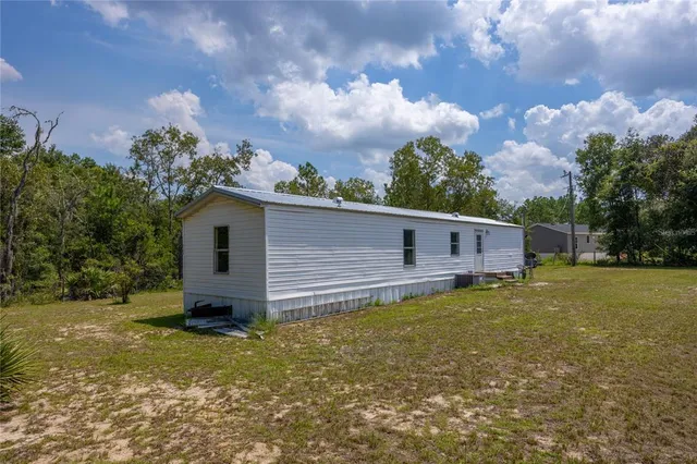 a backyard of a house with lots of green space