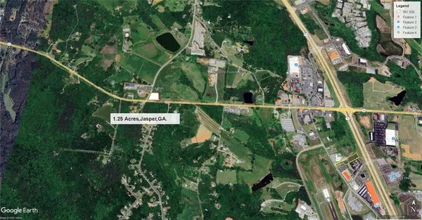 a sign that is sitting on a lush green field