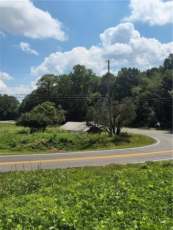 a view of a lake with a house in the background