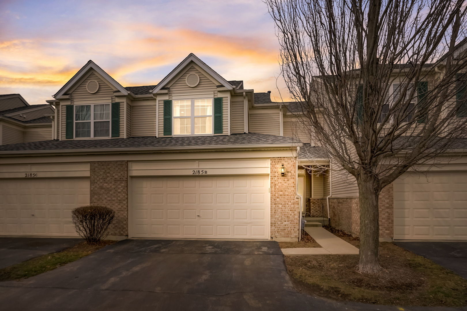 2185 Braeburn Drive, Unit B Wauconda, IL 60084 - Photo 1 of 1 a front view of a house with a yard