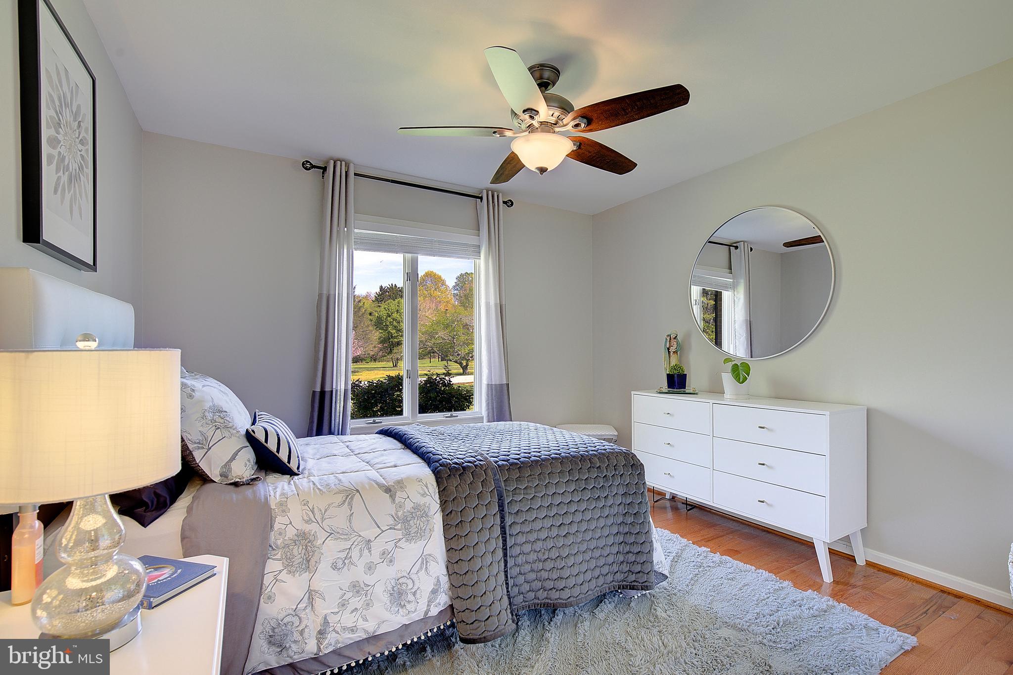 3050 Hickory Ridge Road Dunkirk, MD 20754 - Photo 17 of 78 a bedroom with a bed and a mirror on the dresser