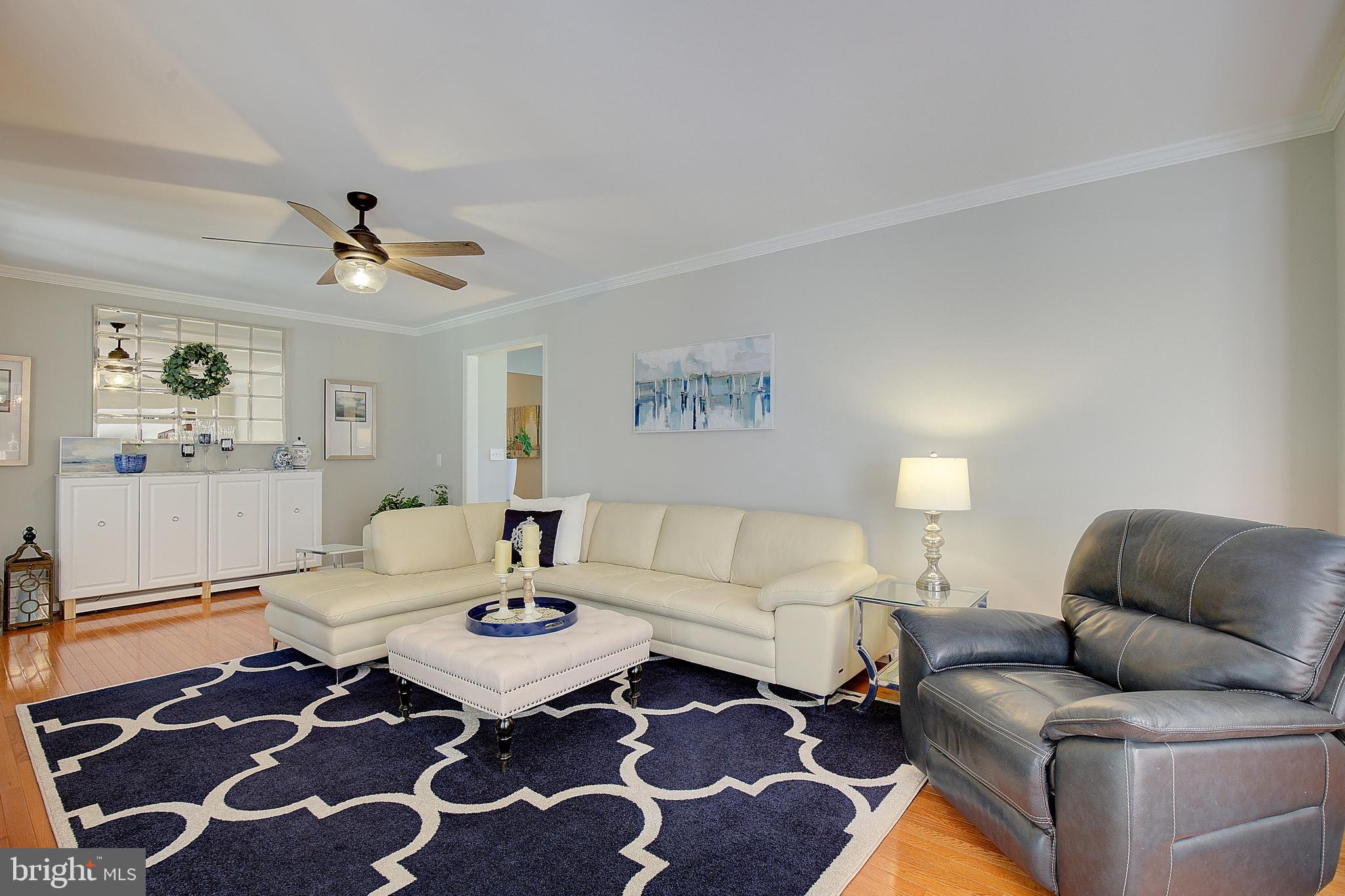 3050 Hickory Ridge Road Dunkirk, MD 20754 - Photo 32 of 78 a living room with furniture and a rug