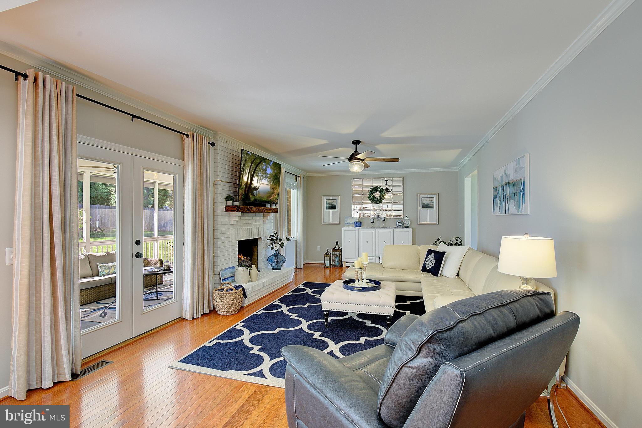 3050 Hickory Ridge Road Dunkirk, MD 20754 - Photo 33 of 78 a living room with furniture flat screen tv and a fireplace