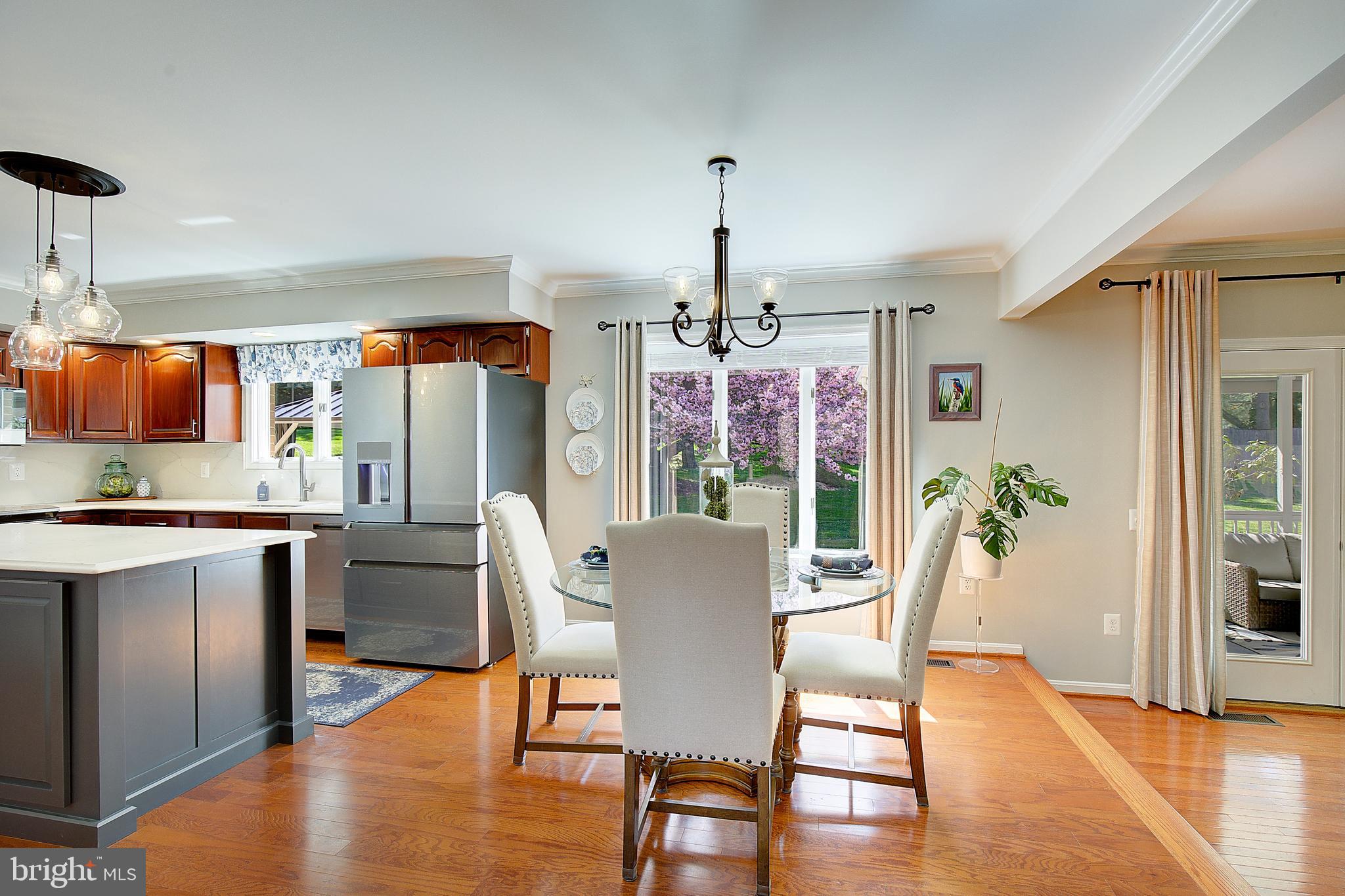 3050 Hickory Ridge Road Dunkirk, MD 20754 - Photo 34 of 78 a view of a dining room with furniture window and wooden floor