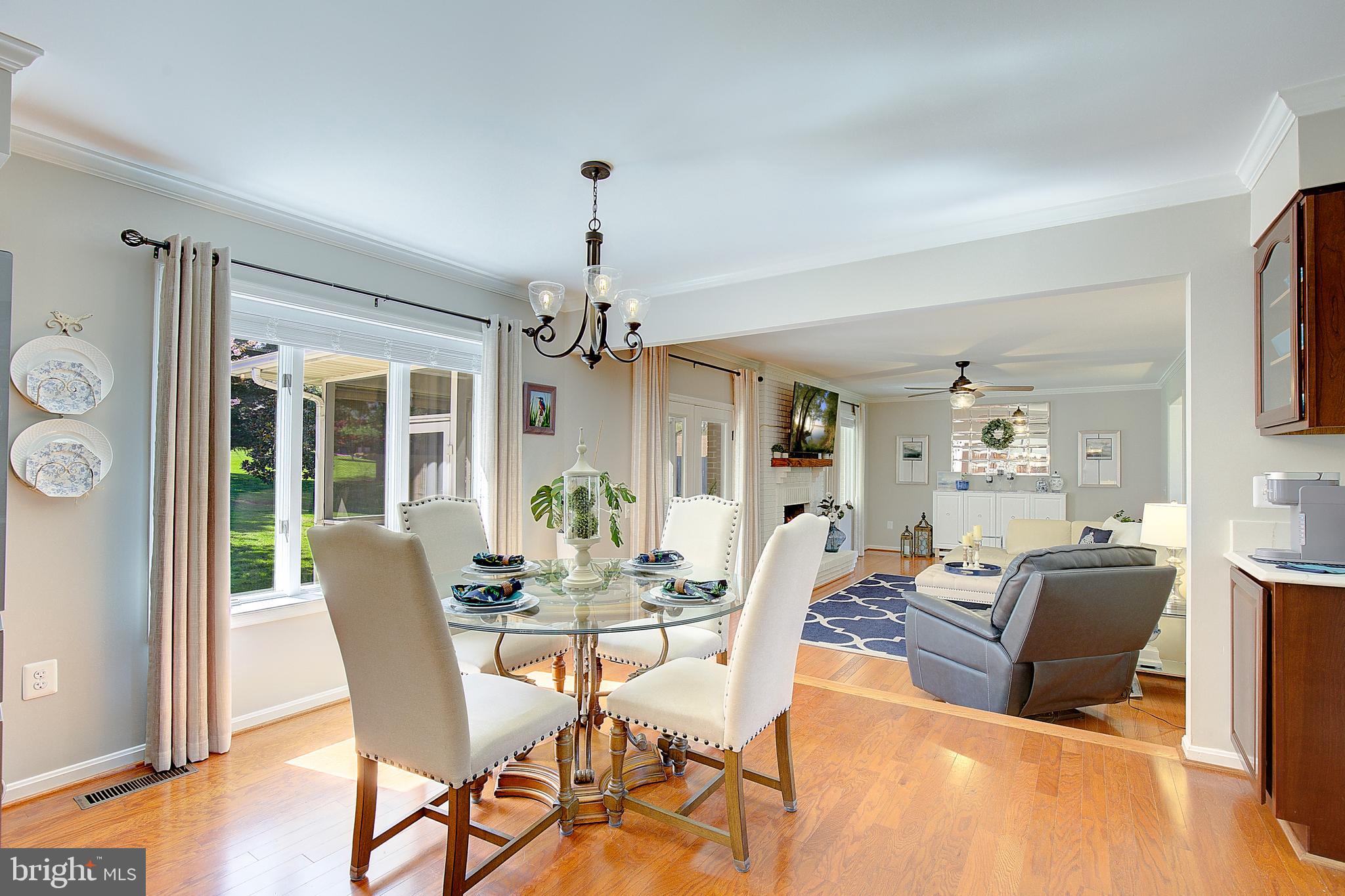 3050 Hickory Ridge Road Dunkirk, MD 20754 - Photo 36 of 78 a view of a dining room with furniture wooden floor and chandelier
