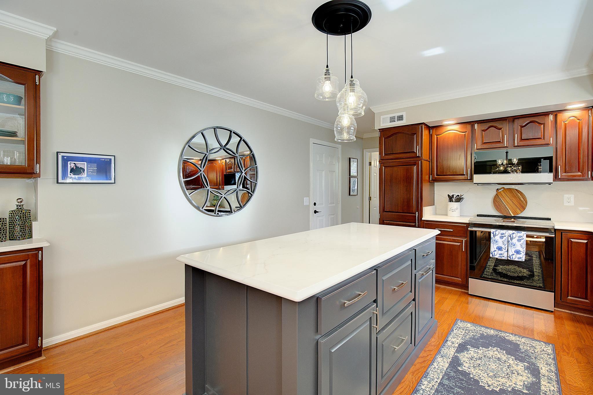 3050 Hickory Ridge Road Dunkirk, MD 20754 - Photo 38 of 78 a kitchen with a stove and a refrigerator