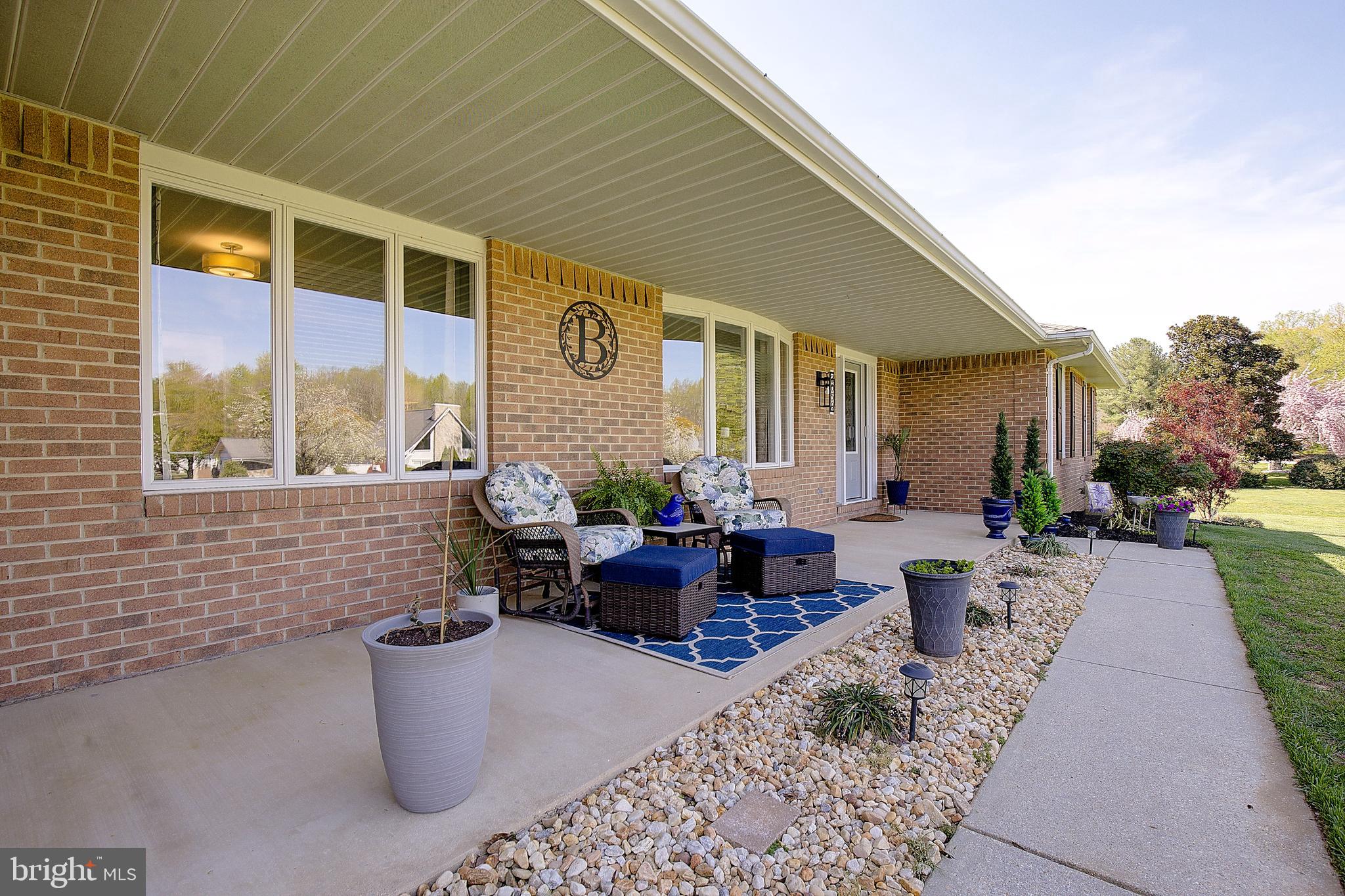 3050 Hickory Ridge Road Dunkirk, MD 20754 - Photo 4 of 78 a view of a patio with couches table and chairs and potted plants