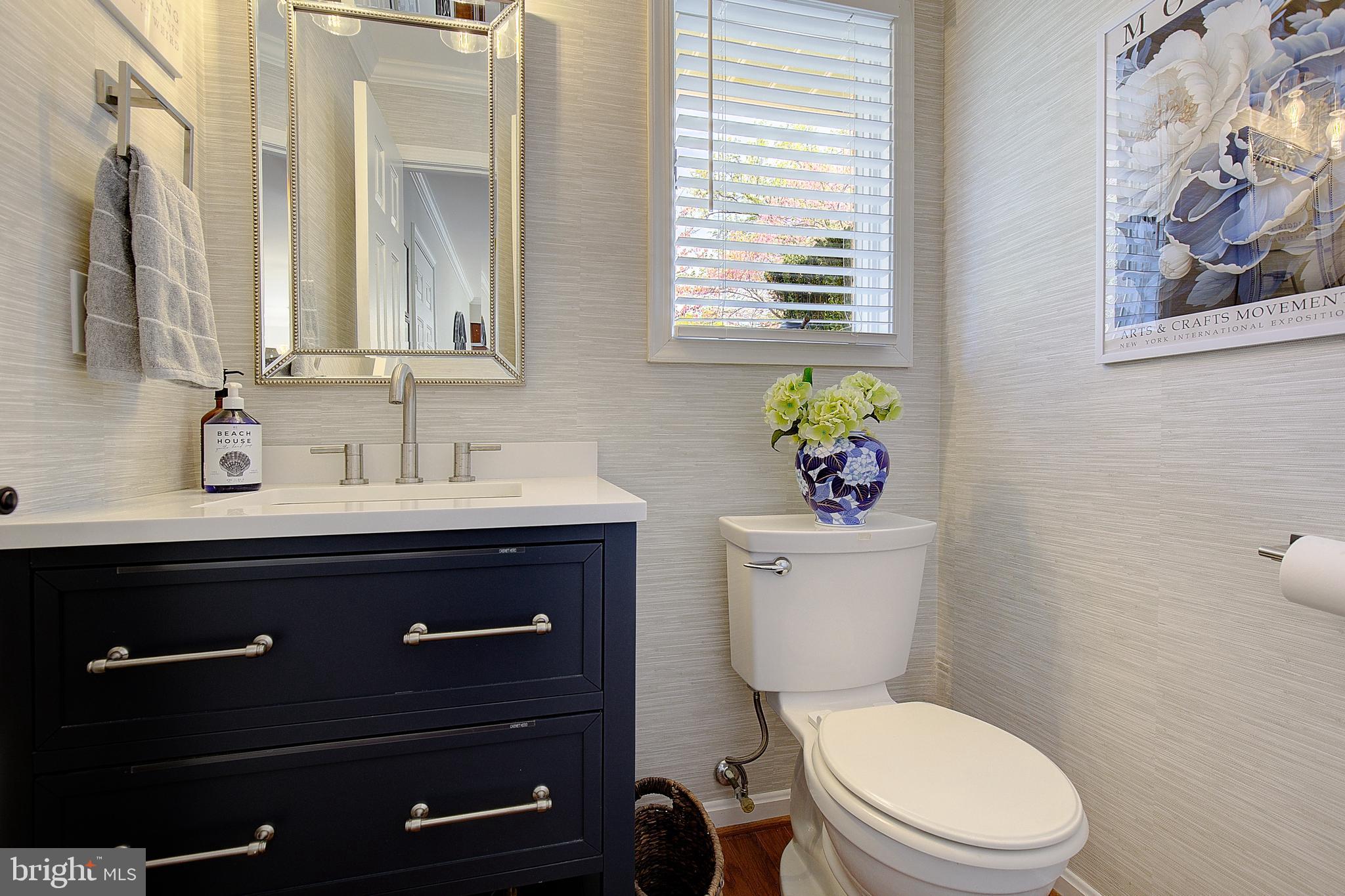 3050 Hickory Ridge Road Dunkirk, MD 20754 - Photo 43 of 78 a bathroom with a toilet a sink and mirror