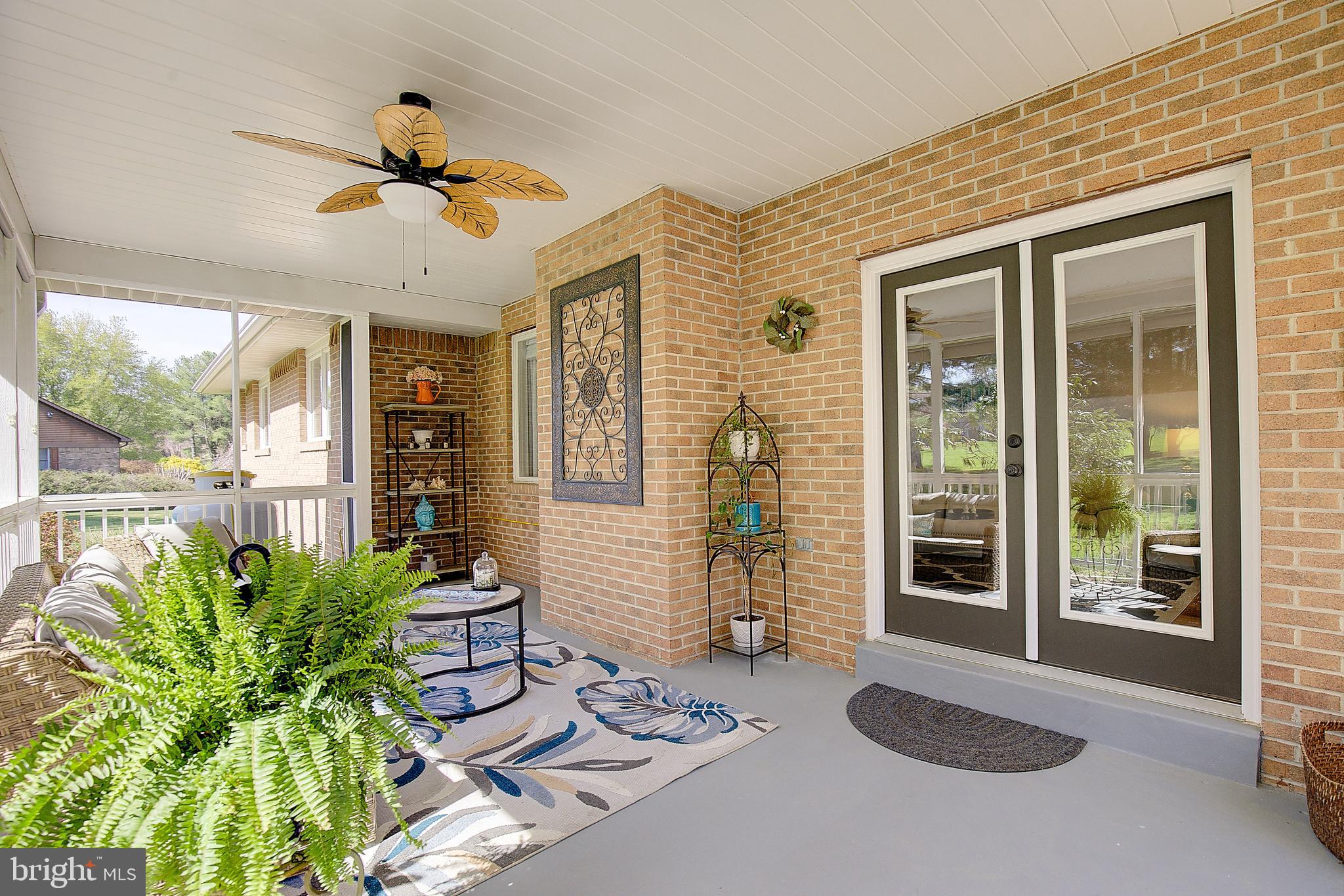 3050 Hickory Ridge Road Dunkirk, MD 20754 - Photo 46 of 78 a living room with patio furniture and a potted plant