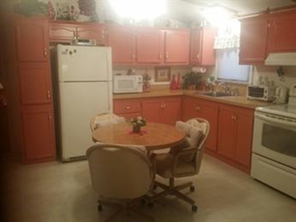 20 Conestoga Trail Brookfield, MA 01506 - Photo 2 of 13 a dining room with furniture and a refrigerator