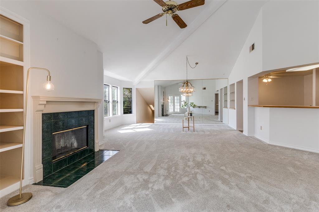 9939 Waterfront Trail Rowlett, TX 75087 - Photo 9 of 25 a living room with furniture and a fireplace