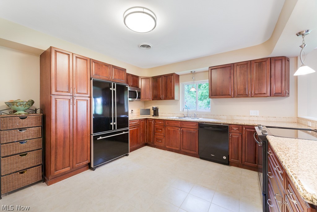 33925 Cannon Road Solon, OH 44139 - Photo 11 of 30 Generous kitchen as granite counters and includes all appliances