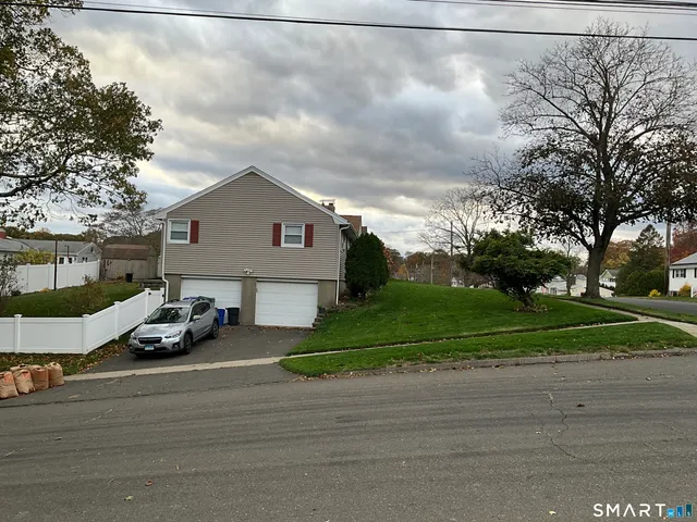 a view of a car in front of a house