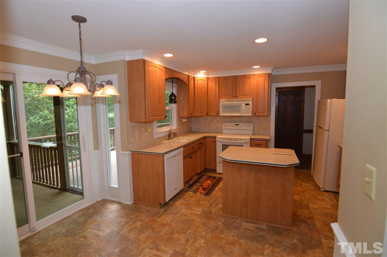 8128 Calais Court Raleigh, NC 27613 - Photo 14 of 30 Center island, solid surface counters