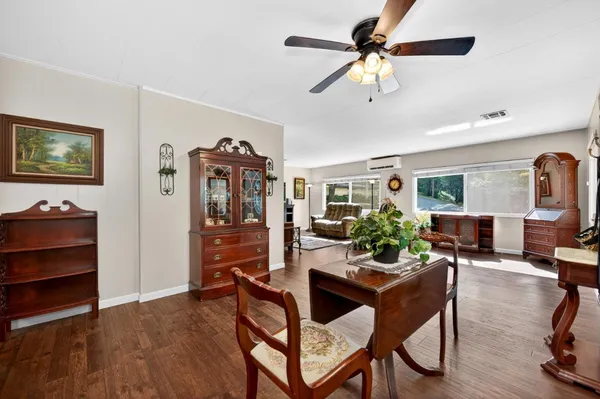 a view of a livingroom with furniture and a flat screen tv