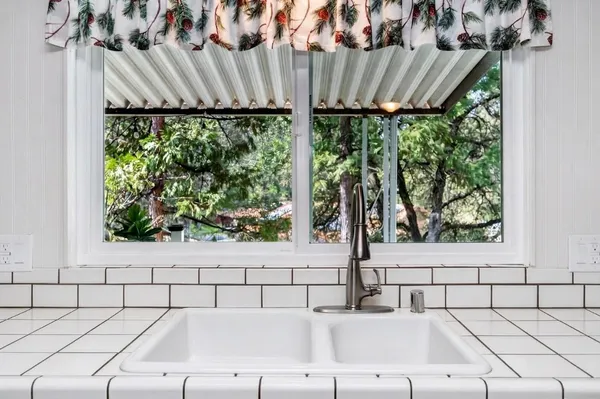a bathroom with a bathtub and window
