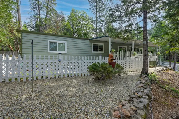 a view of house with trees in the background