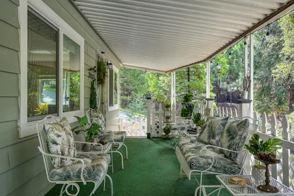 a house view with a seating space and garden view