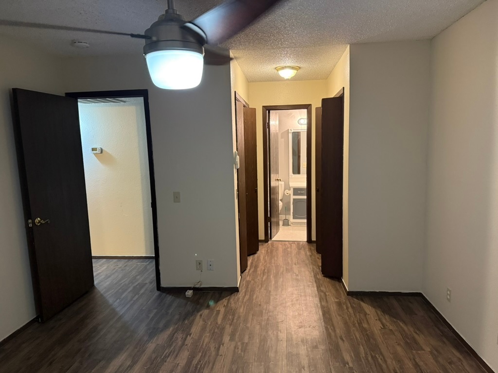 907 East Meadowmere Lane Austin, TX 78758 - Photo 12 of 23 an entryway of a room and wooden floor