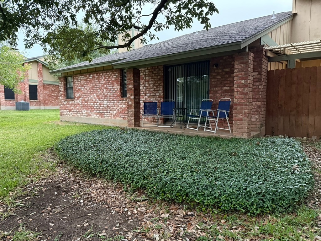 907 East Meadowmere Lane Austin, TX 78758 - Photo 16 of 23 a view of a house with a yard and sitting area